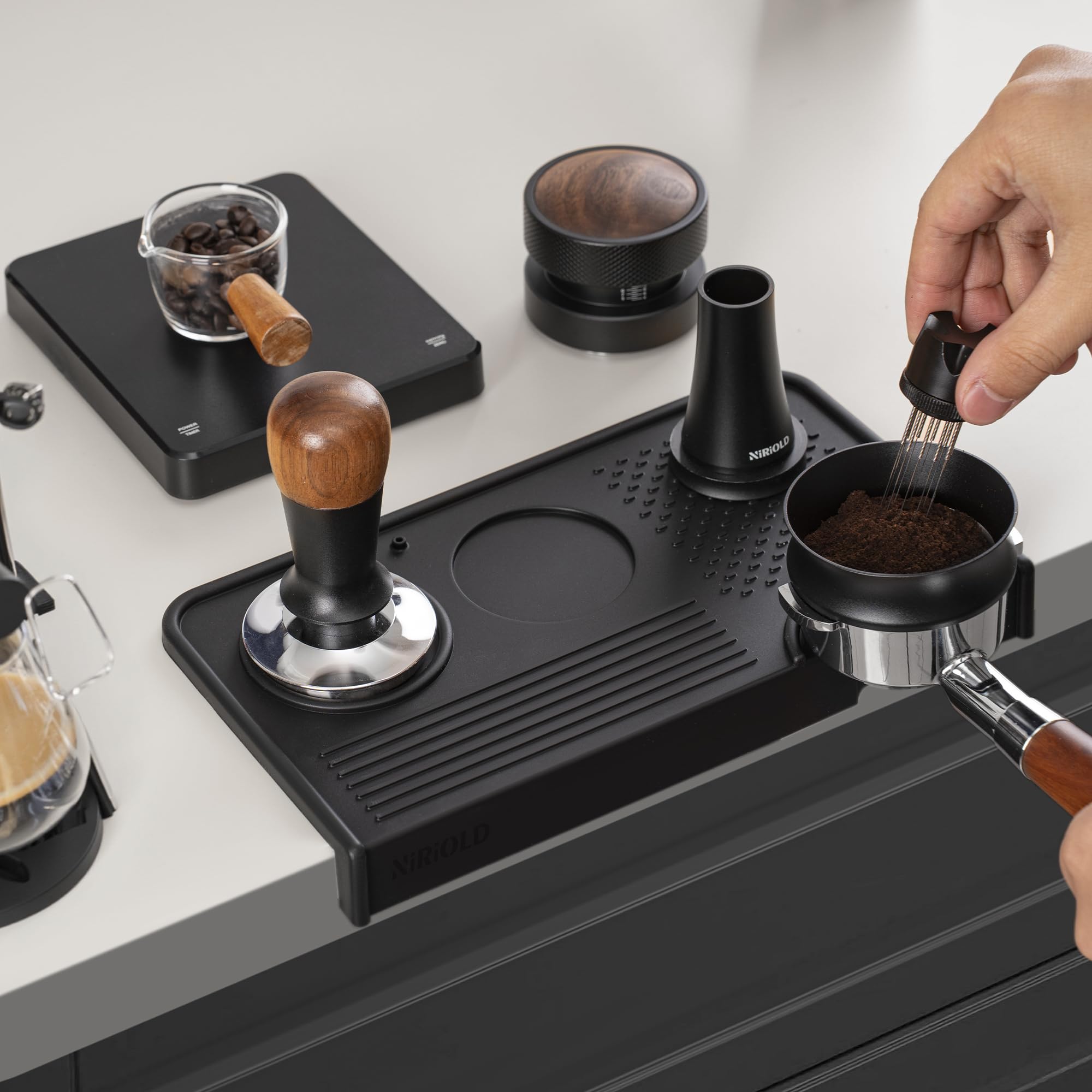 niriodl easy-clean mat; simply rinse after espresso sessions.