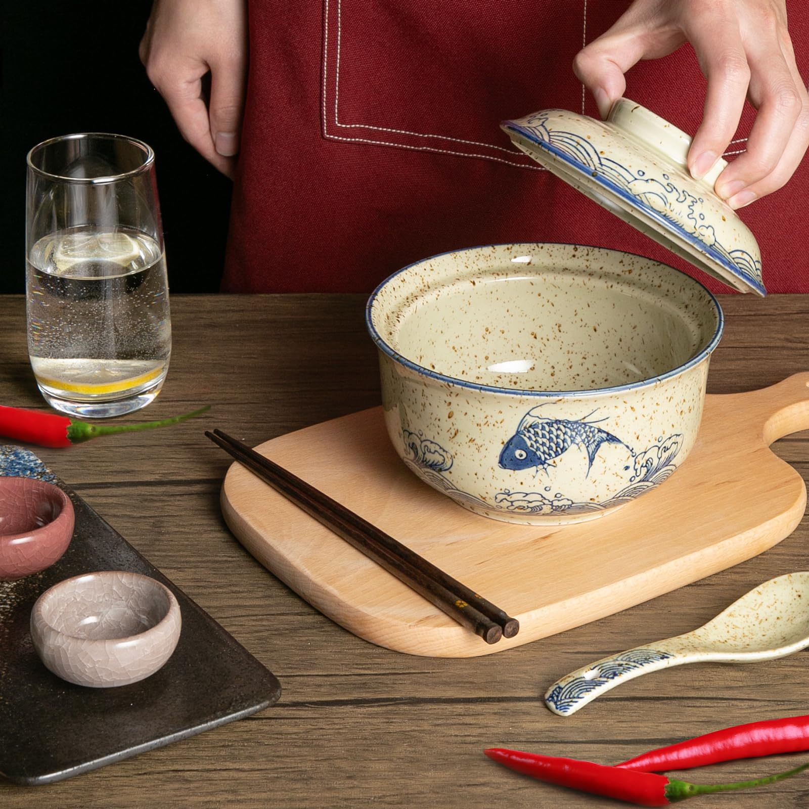 Niturceal spoon and chopsticks pair complements noodles and toppings.