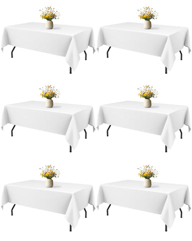 Niuara white rectangle table cloth draped on a 5ft table for an elegant dining setup
