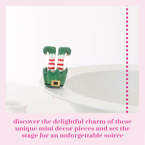 Nora Fleming elf feet ceramic decor adds whimsical charm to your holiday vignette.