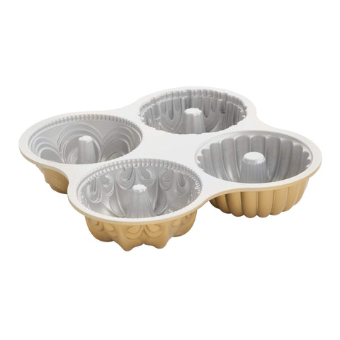 Nordic Ware Bundt Quartet Pan in gold, swirl design for stunning cakes.