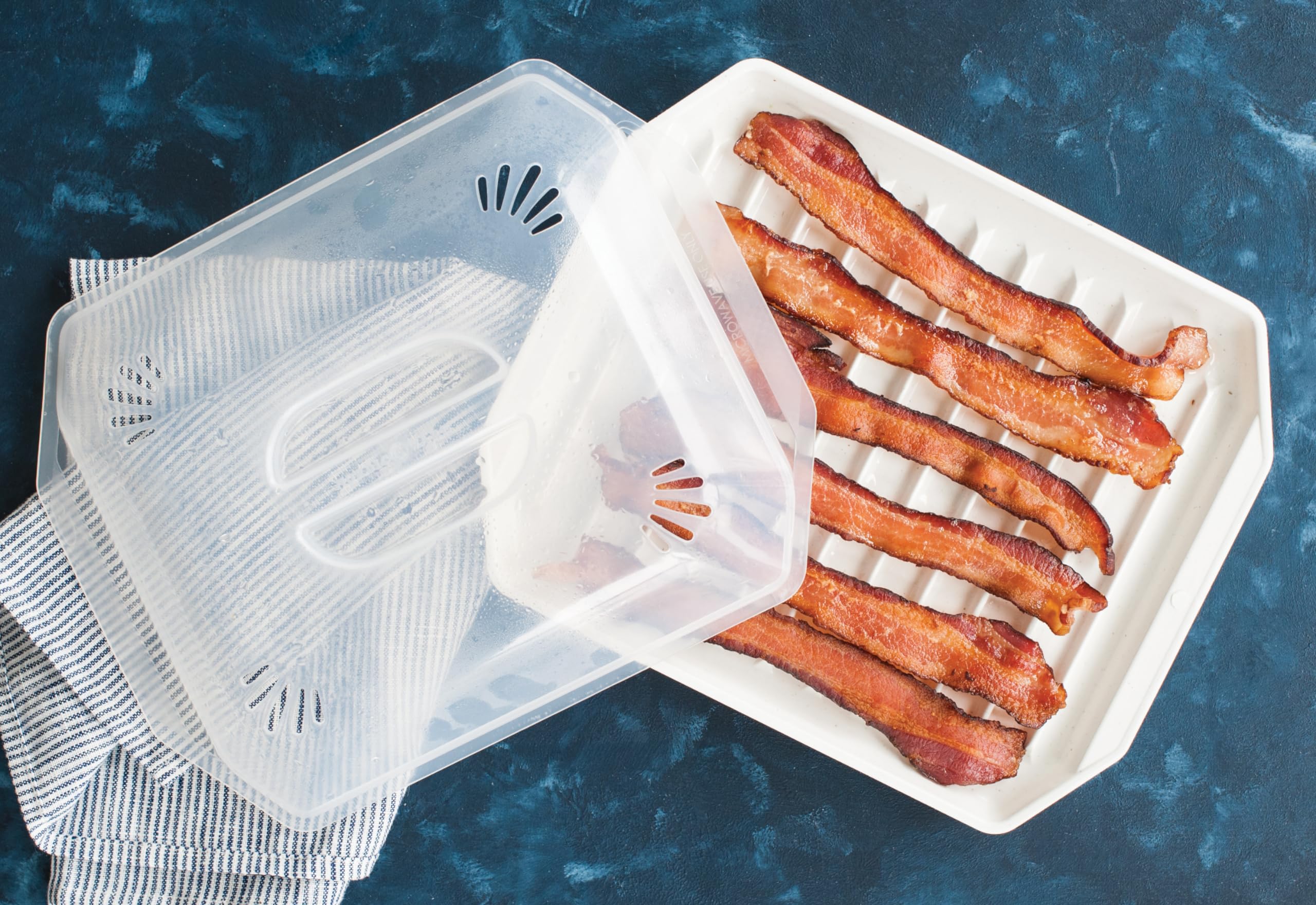 Nordic Ware bacon rack ribbed surface keeps grease away from meat.