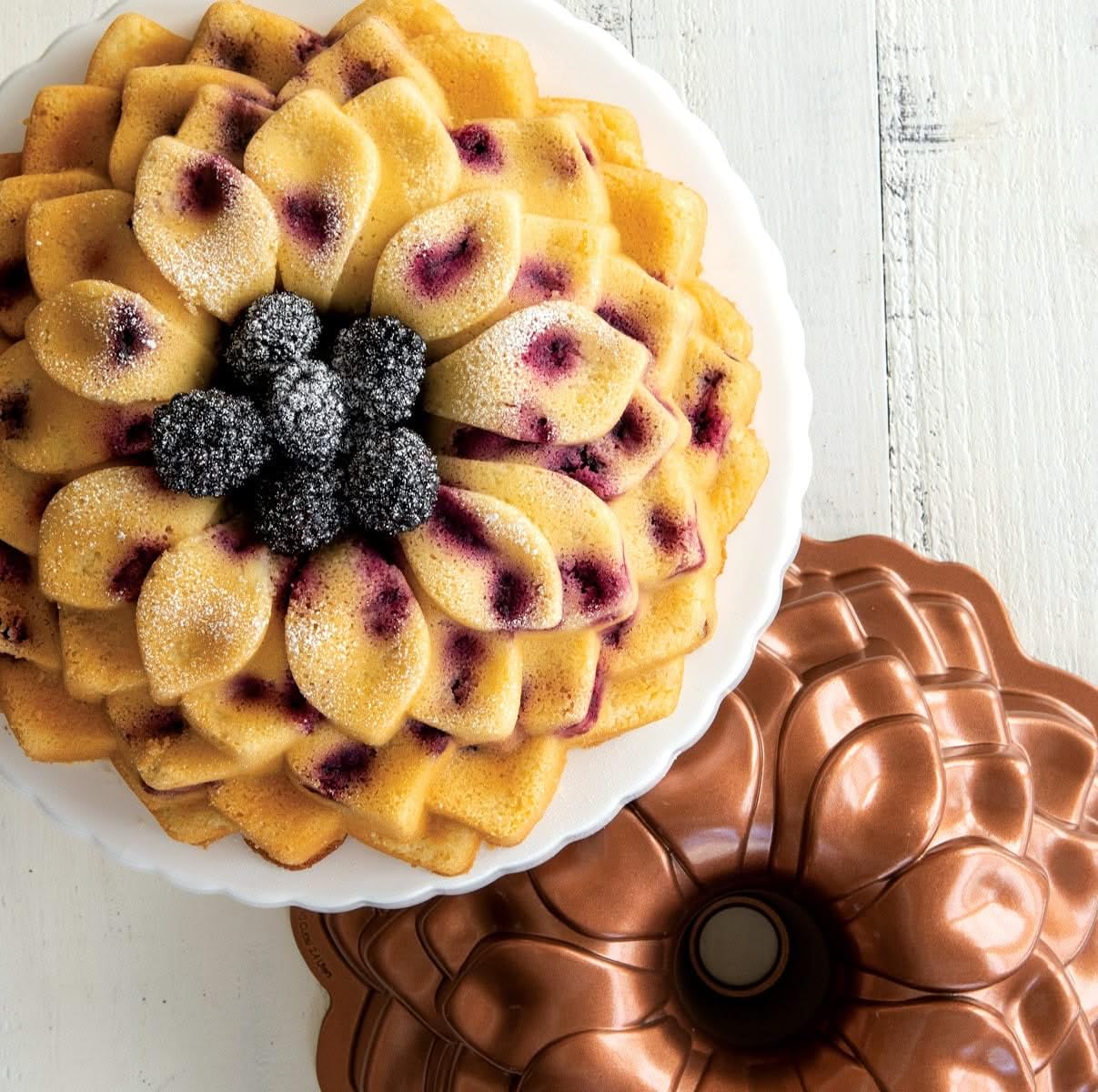 Nordic Ware Blossom Bundt Pan safe in oven up to 400°F for versatile baking.