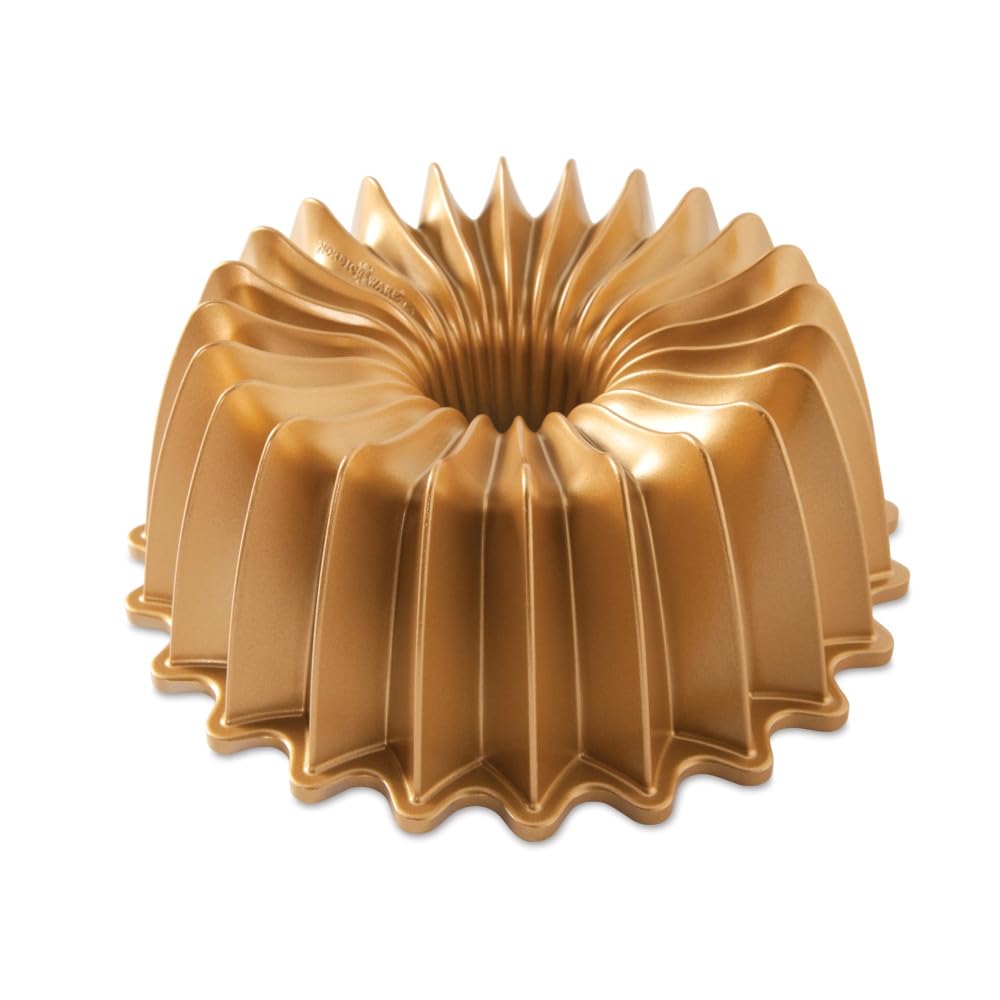 Nordic Ware Brilliance Bundt 10-cup gold top view shows gem-like flutes for elegant cakes