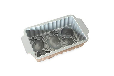 Nordic Ware Citrus Blossom loaf pan filled with batter ready to bake.