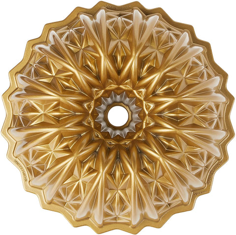 Nordic Ware Cut Crystal Bundt pan in gold with intricate swirl close-up