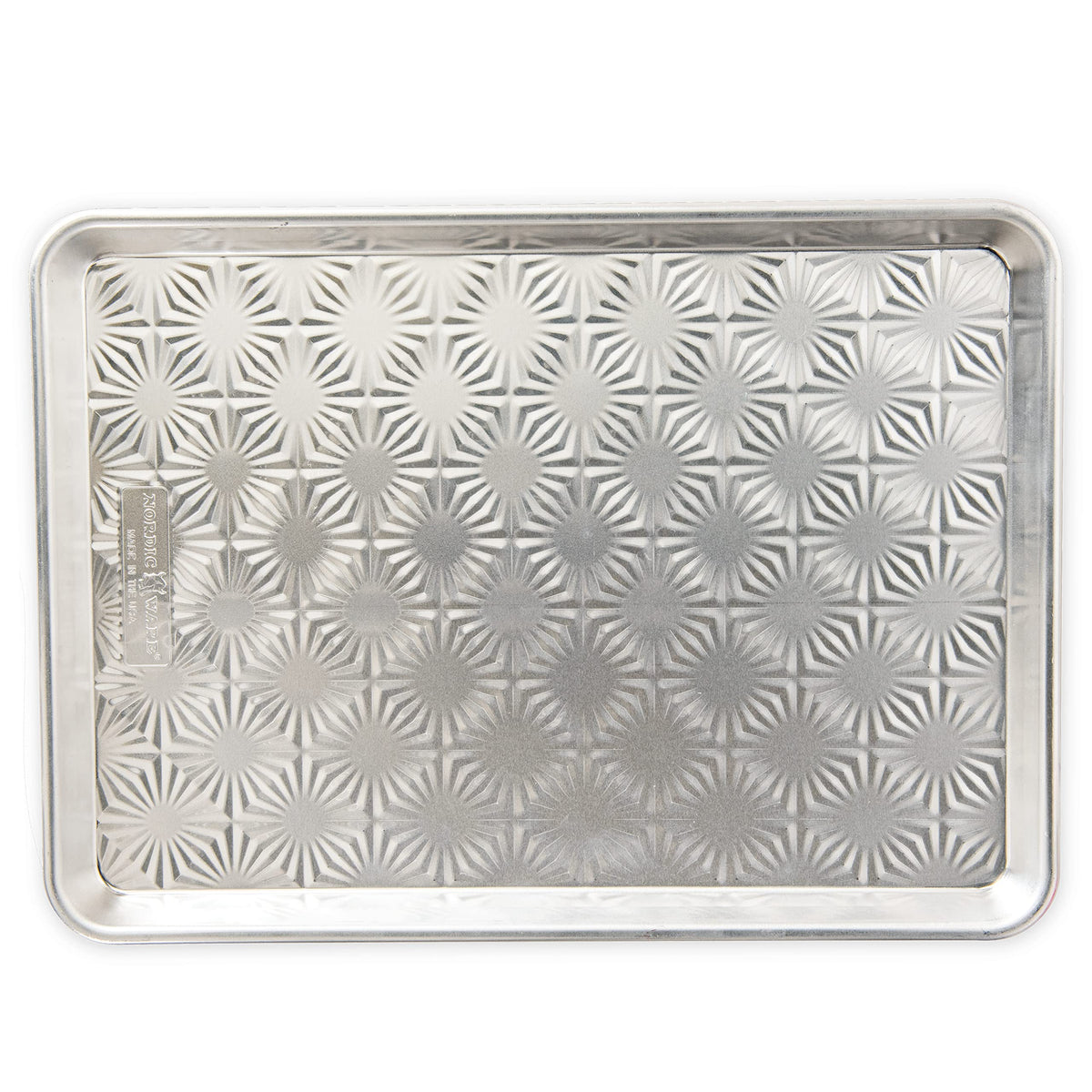 Nordic Ware embossed starburst pan; top view highlights browning potential.