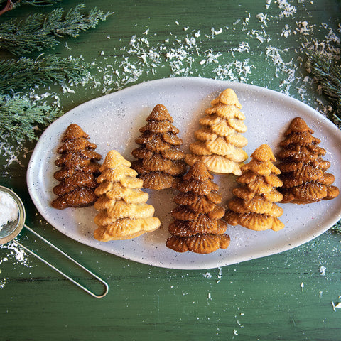 Nordic Ware Evergreen Cakelets nonstick coating aids easy release during baking.