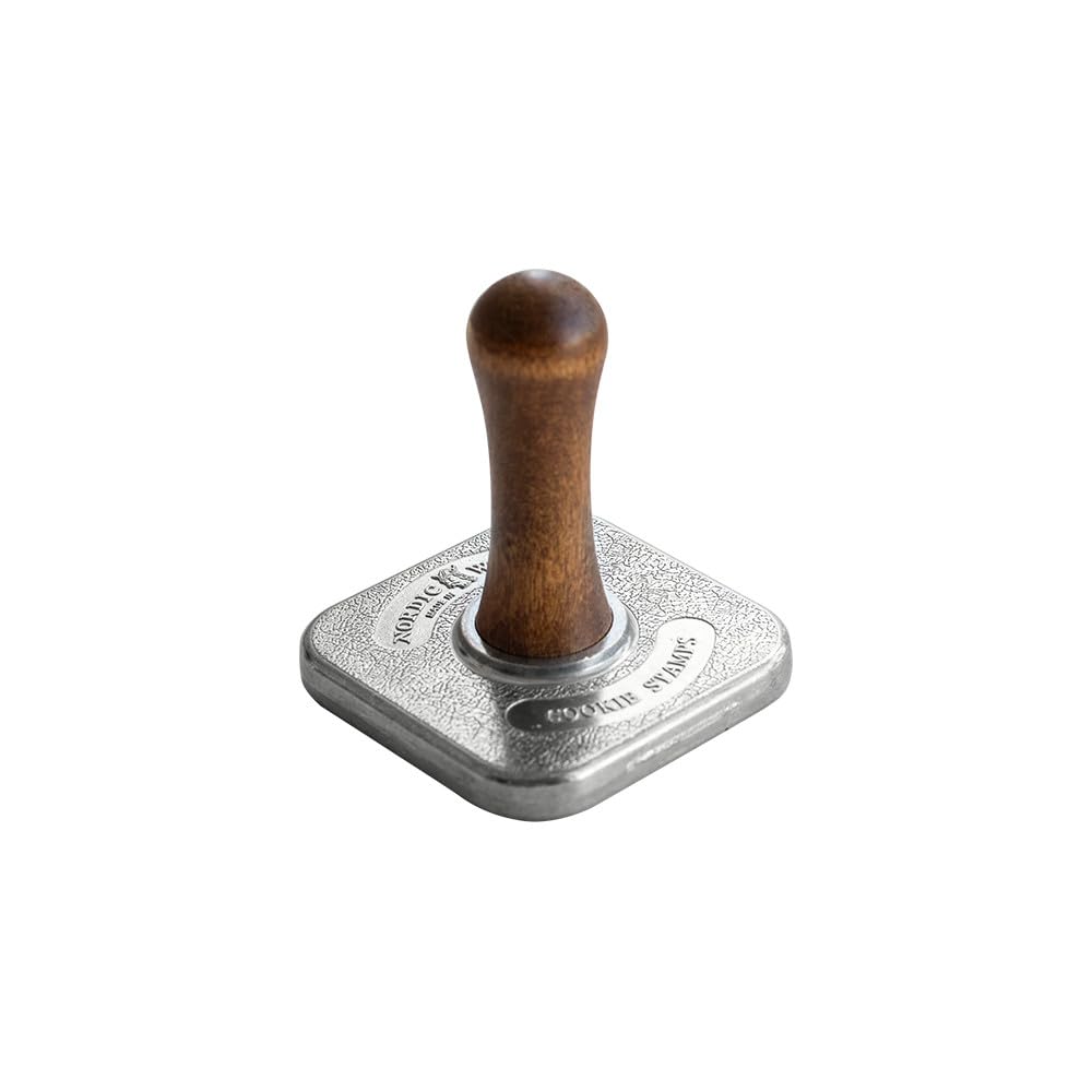 Nordic Ware holiday cookie embossing set for playful baking results.