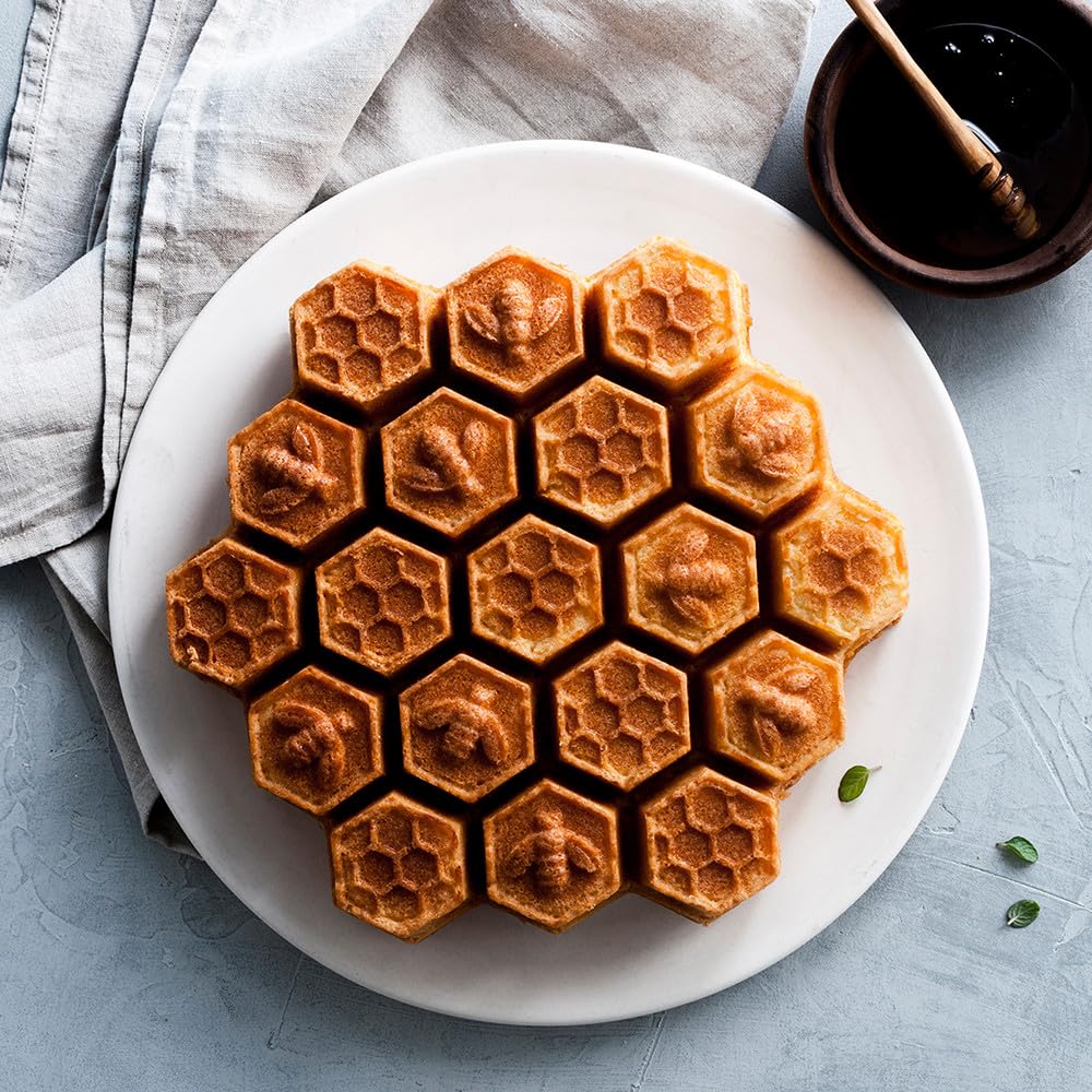 Nordic Ware Honeycomb Pan 19 cakelets display emphasizes portions-friendly baking and even browning.