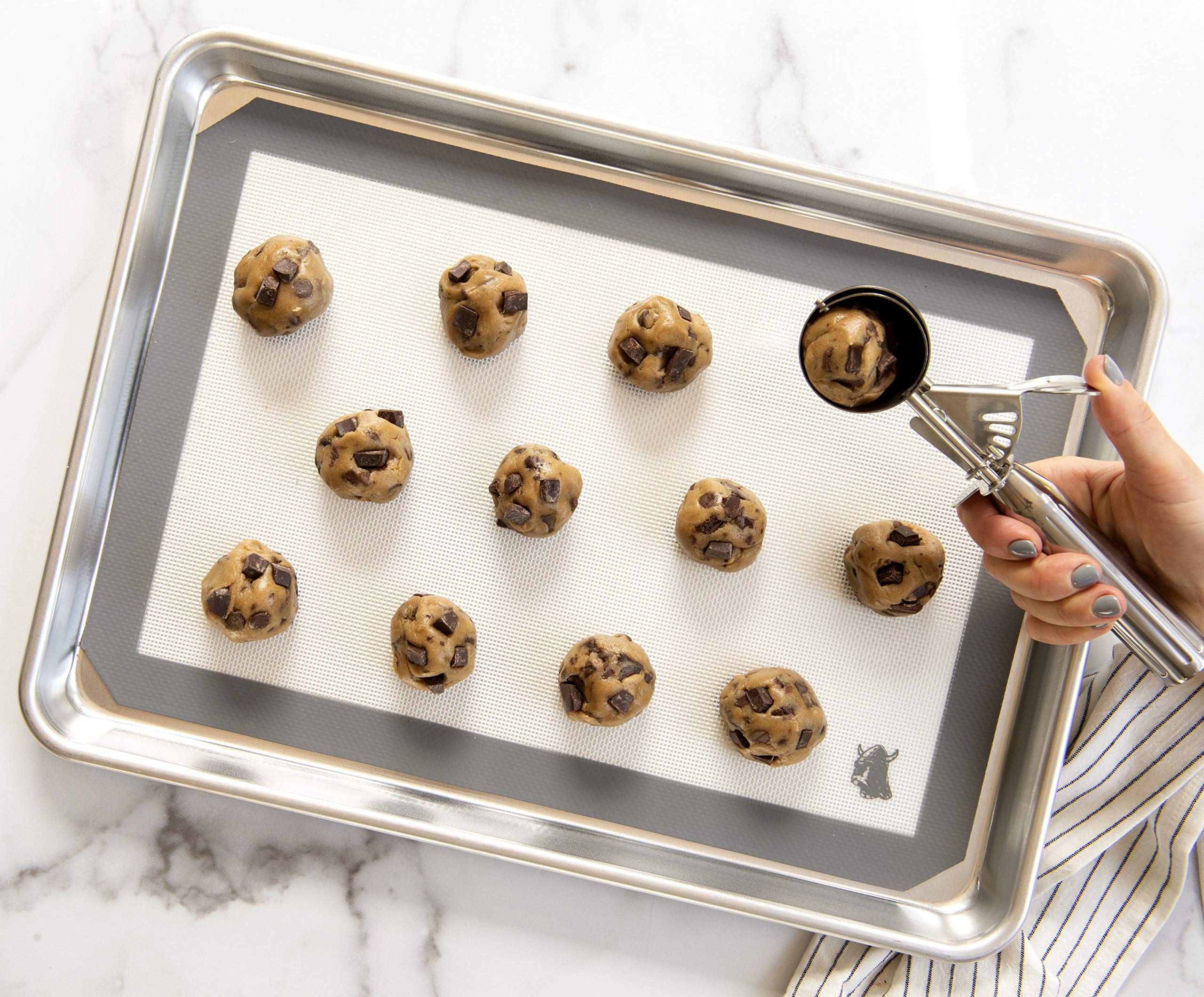 Nordic Ware large cookie scoop easy to clean by hand.
