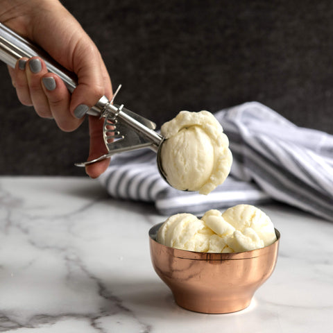 Nordic Ware large cookie scoop portioning muffins and cupcakes.