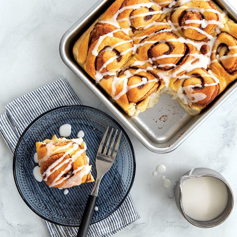 Nordic Ware pan lined with parchment paper demonstrates versatile baking setup for sweet or savory dishes