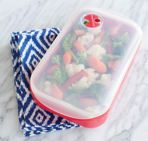 Nordic Ware Steam Cooker removable tray lifts food for optimal steam circulation.