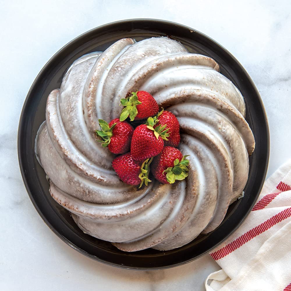 Nordic Ware Swirl Bundt Pan gold, 9.4-inch diameter, 10-cup capacity.