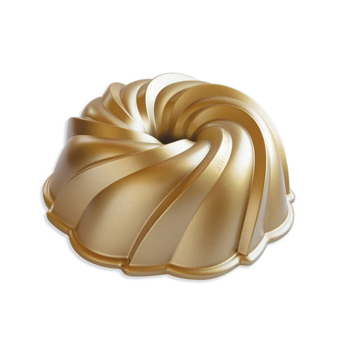 Nordic Ware Swirl Bundt Pan in gold, top view, ideal for elegant desserts.