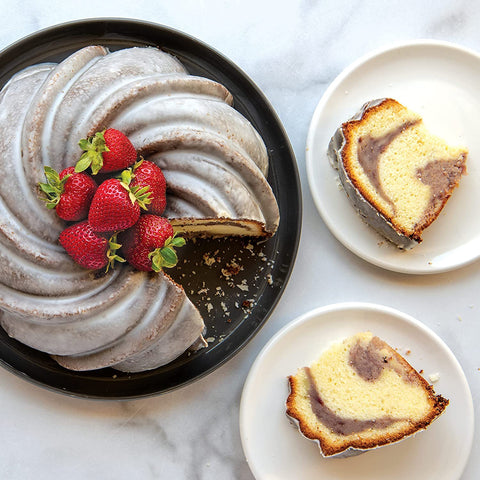 Nordic Ware Swirl Bundt Pan gold, nonstick interior for effortless cleanup after baking.