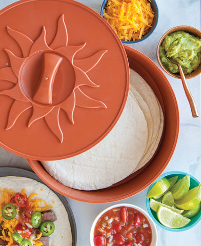 Nordic Ware tortilla-warmer in use serving tortillas at table