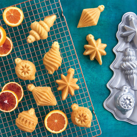 Nordic Ware Vintage Ornament Cakelet Pan interior detail highlights intricate ornament shapes for even baking