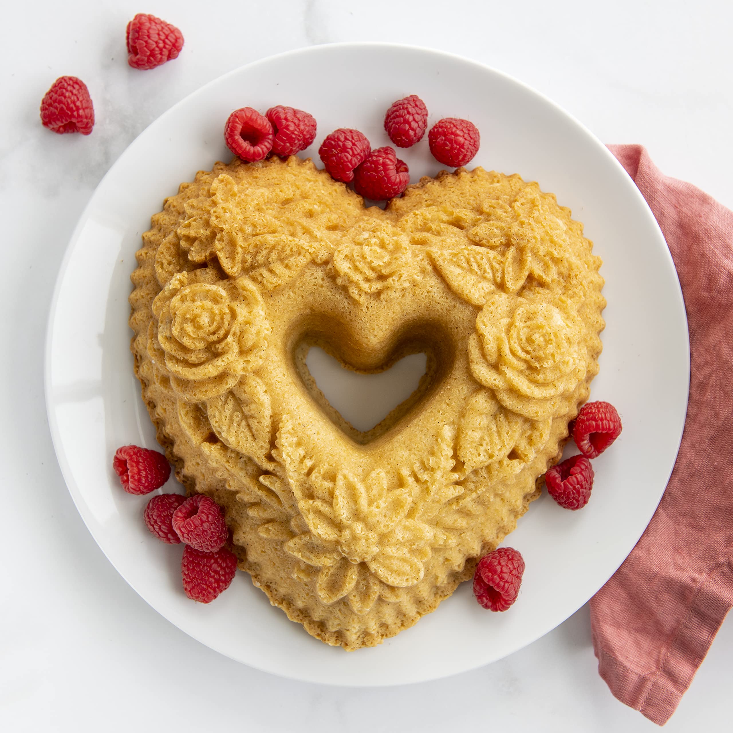 Nordic Ware Wildflower Heart Bundt pan highlights 6-cup capacity for recipe portions.