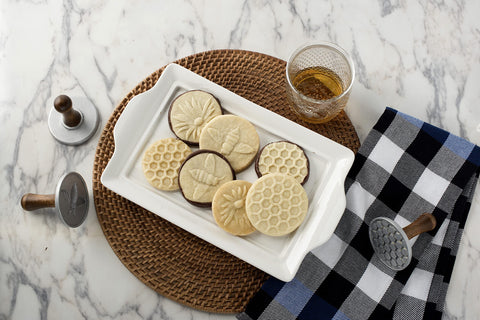 Nordic Ware wooden handles offer comfortable grip during stamping.