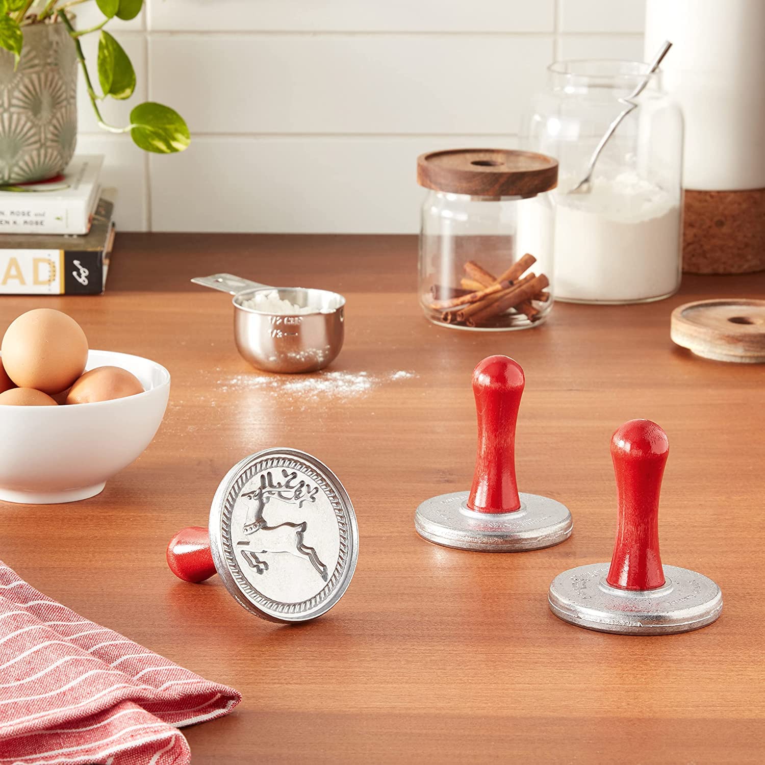 Nordic Ware Yuletide stamps are hand-wash only; wipe handles gently.