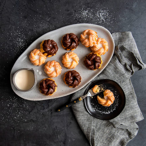 Nordic Ware 95377 Bundtlette Pan gold in use with mini bundt bites.