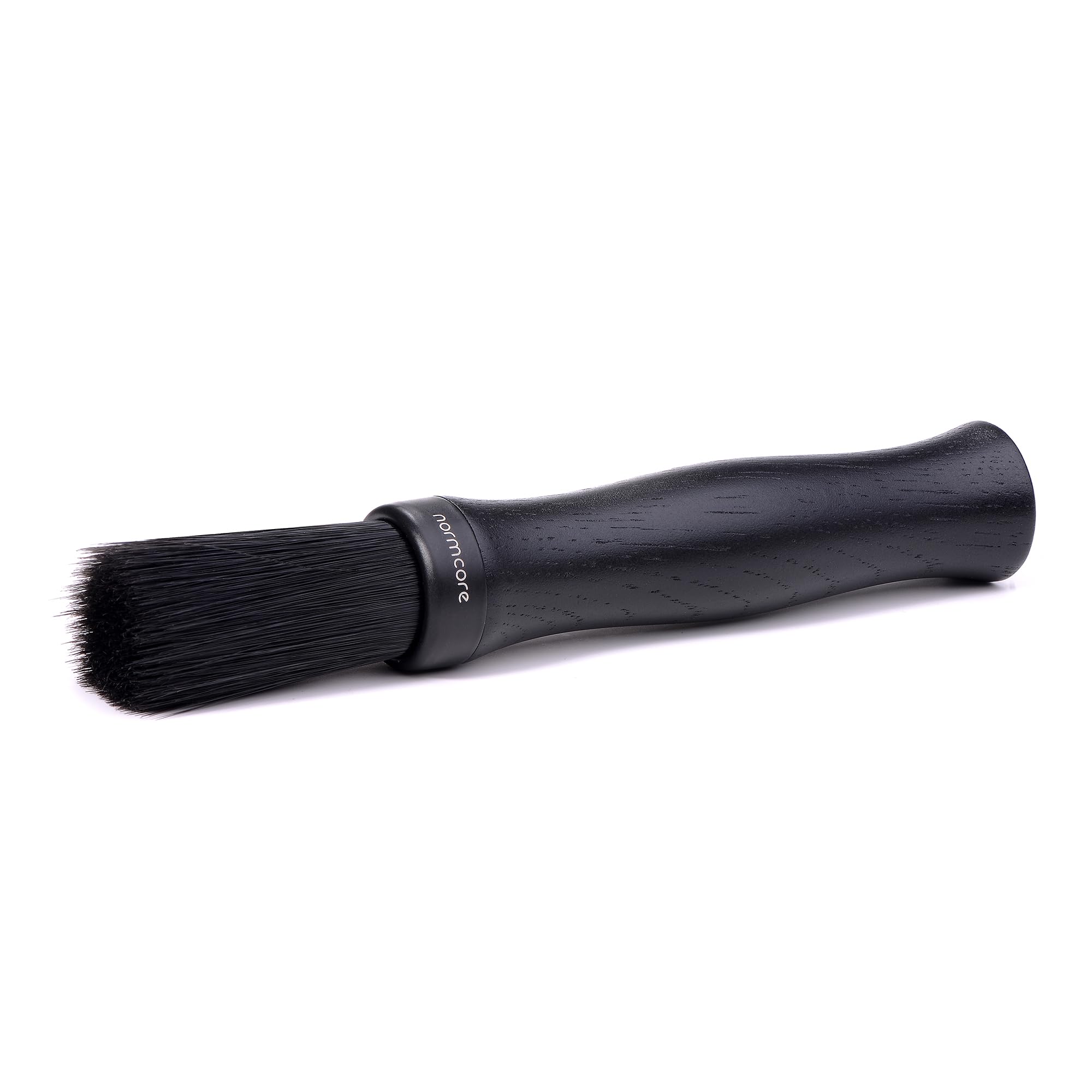 Normcore Barista Brush with black oak handle removing coffee grounds