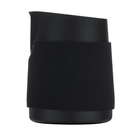 Normcore milk pitcher silicone heat-resistant grip for secure, comfortable pouring.