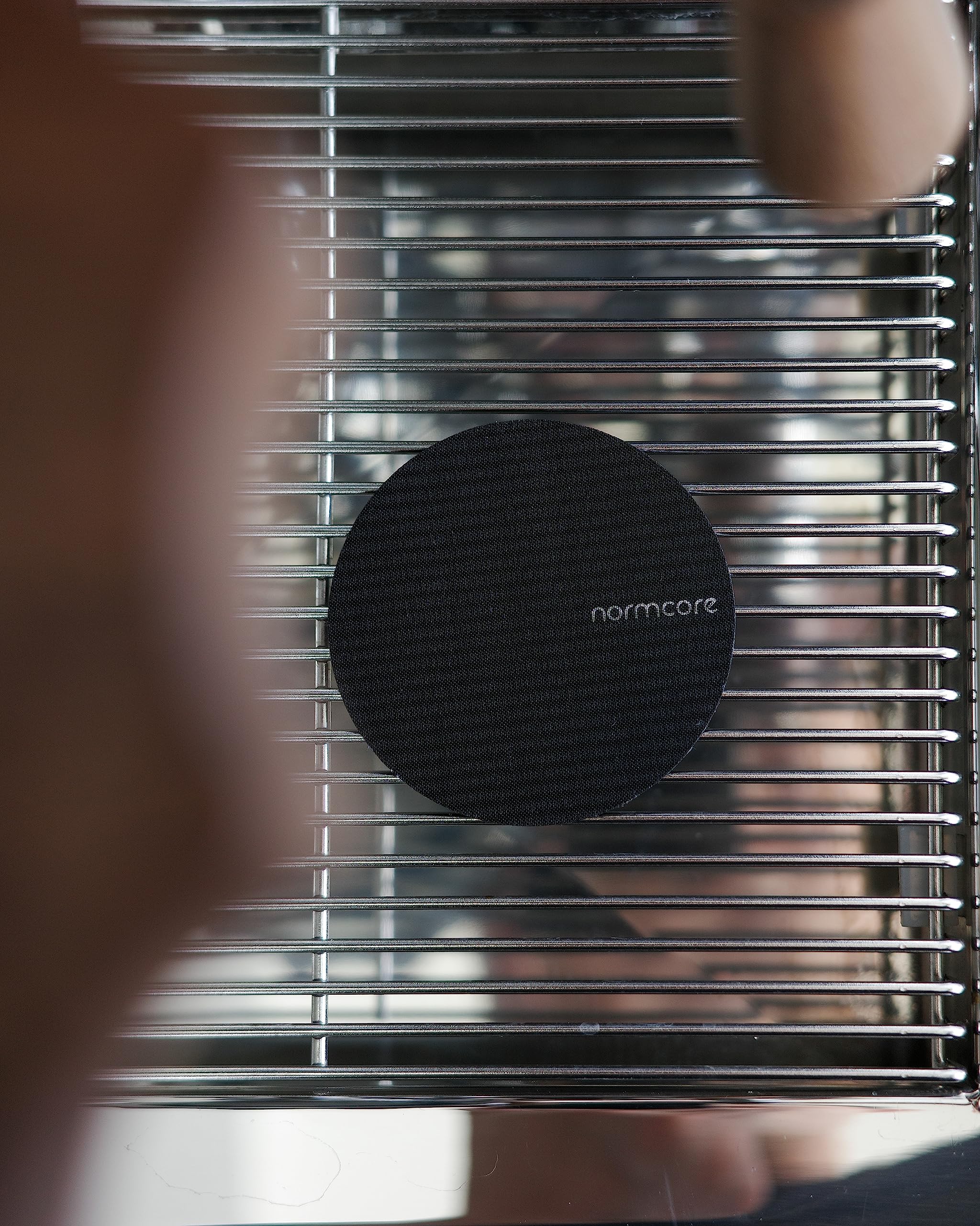 Normcore puck screen 100μm mesh close-up highlights fine filtration for balanced extraction.