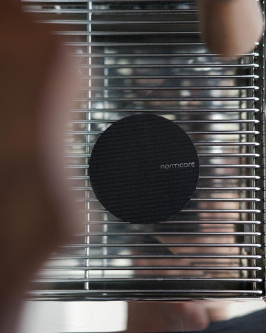 Normcore puck screen 100μm mesh close-up highlights fine filtration for balanced extraction.