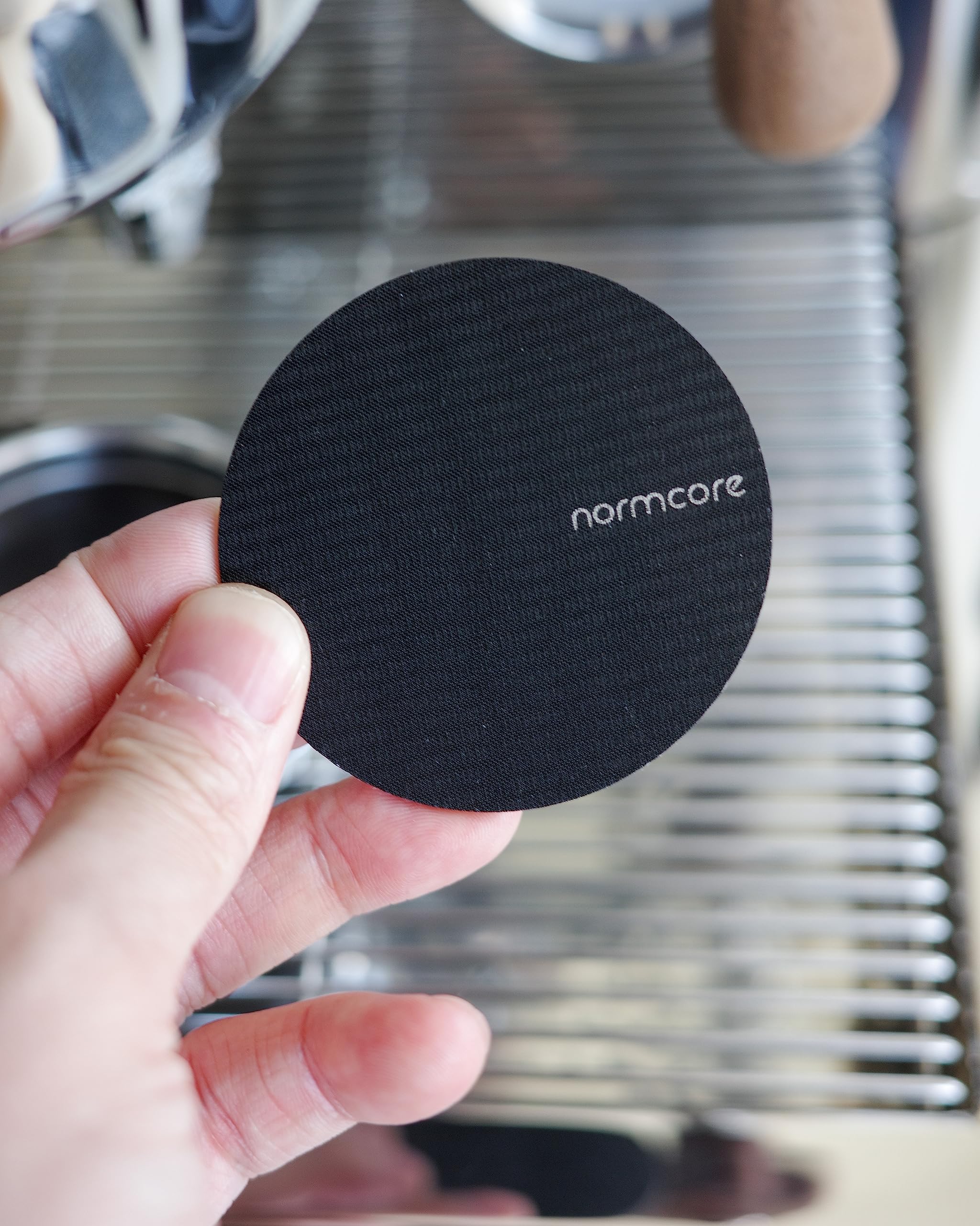 Normcore 316 stainless steel puck screen provides corrosion resistance for daily espresso use.
