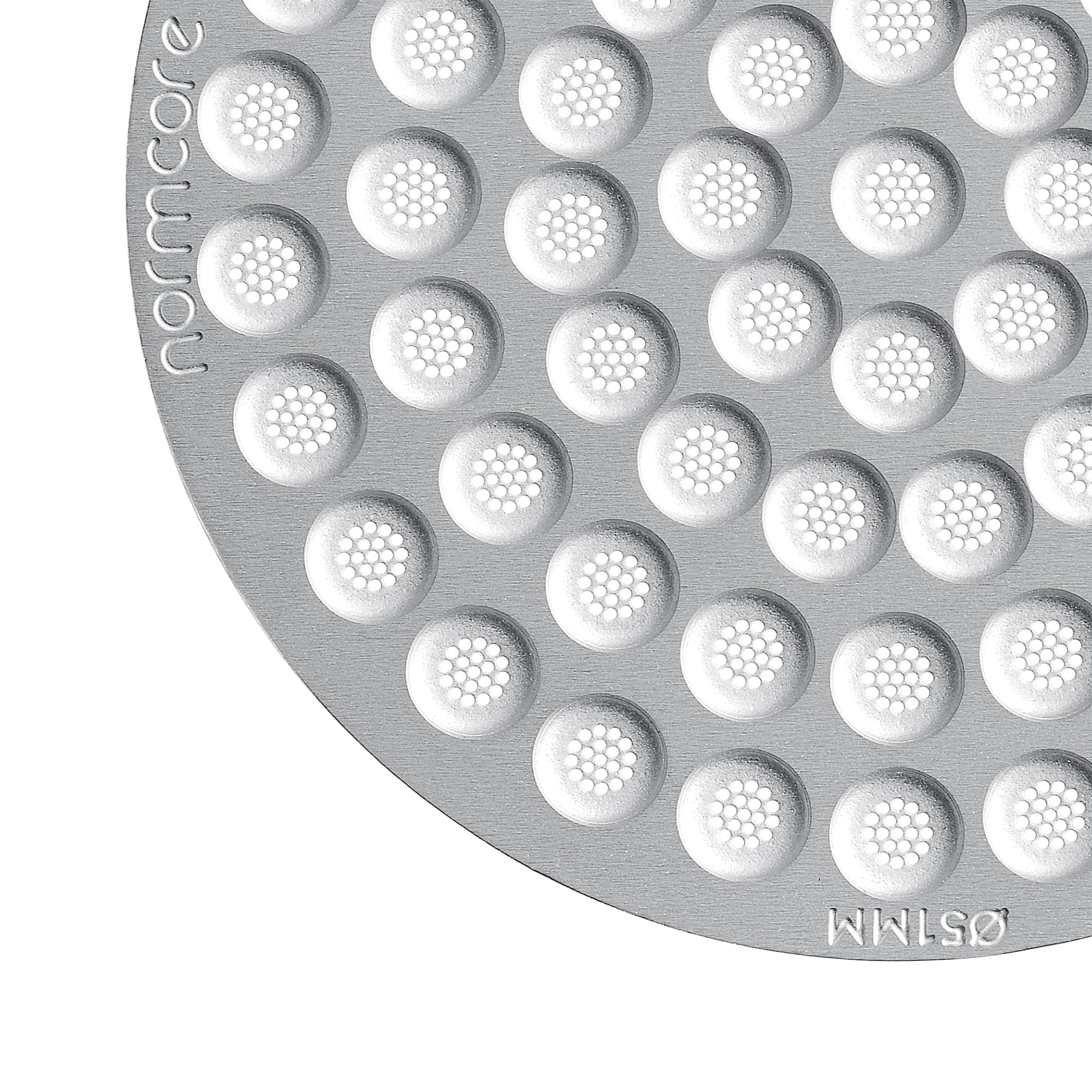 Normcore puck screen in use over the brew head for easier maintenance