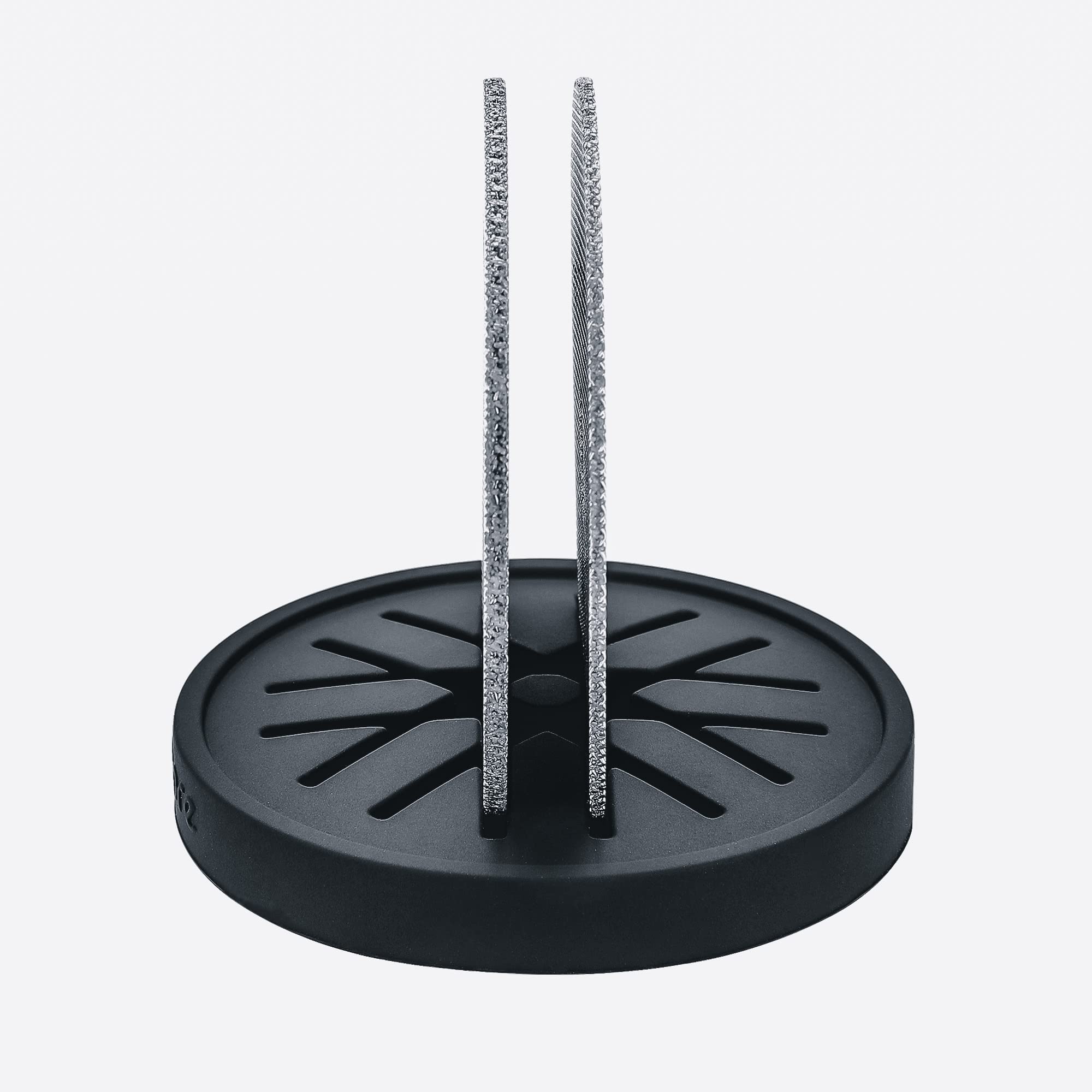 Normcore silicone stand cradles the puck screen upright for easy use.