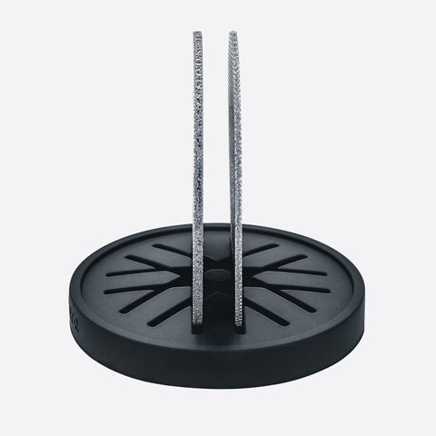 Normcore silicone stand cradles the puck screen upright for easy use.