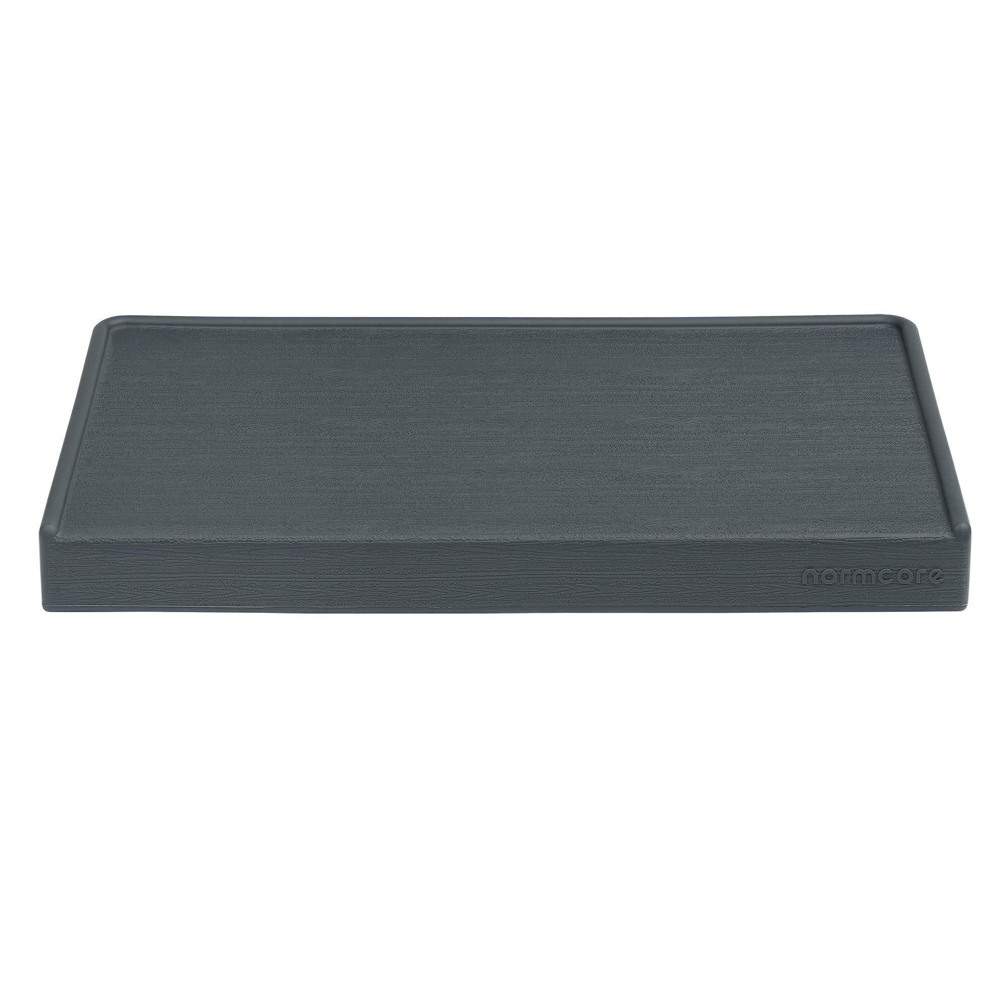 Normcore tamping mat includes tamper storage for quick tool access.