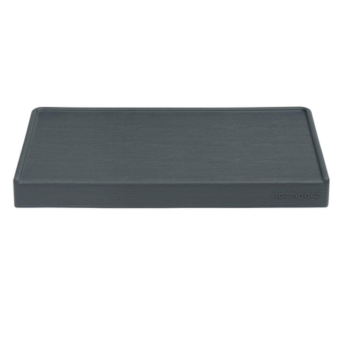 Normcore tamping mat includes tamper storage for quick tool access.