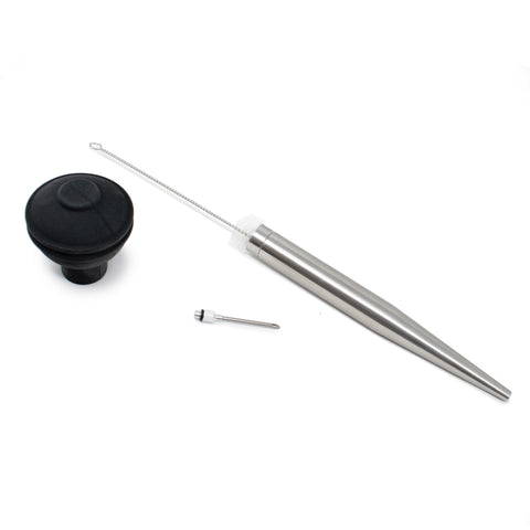 Norpro baster drawing juices from pan for basting