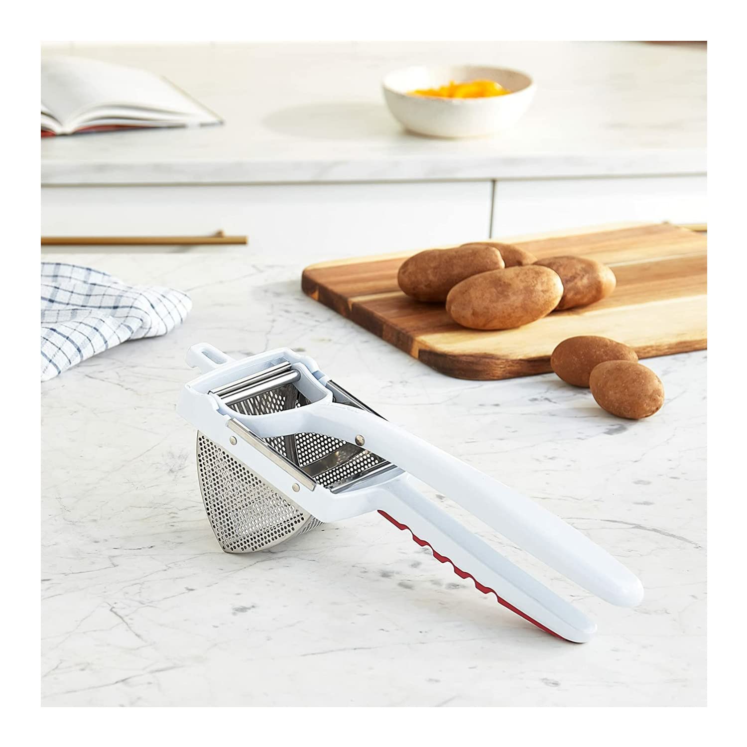 Norpro Deluxe Jumbo Potato Ricer disassembled for easy cleaning and storage.