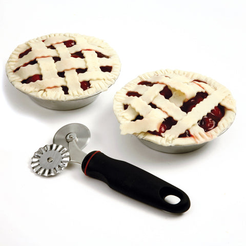 Norpro Grip-EZ wheel in use trimming dough and cutting decorative edges