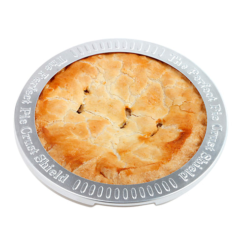 Norpro pie crust shield on pie demonstrates even edges and reduced spill risk