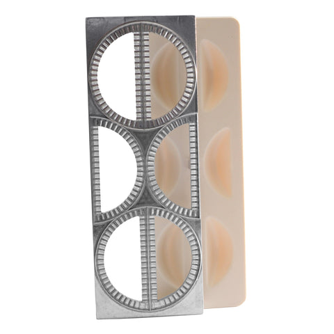 Norpro pierogi maker press shapes six evenly formed dumplings.