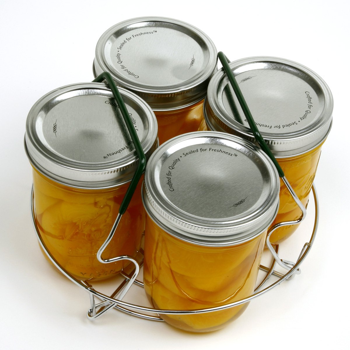 Norpro small canning rack with comfort-grip handles resting on pot rim for stability