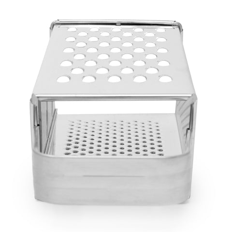Norpro grater breaking garlic and ginger into fine particles.