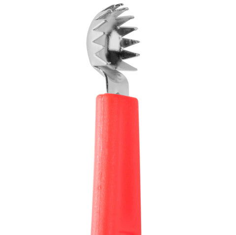 Norpro corer with stainless steel teeth slicing through tomato