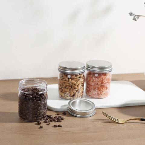 novelinks clear jars with silver lids for sleek kitchen storage.