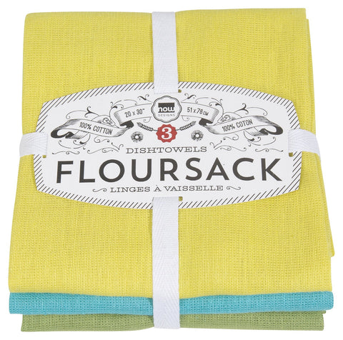 Now Designs flour sack towel with chartreuse, turquoise, and leaf pattern on counter, ideal for drying glassware