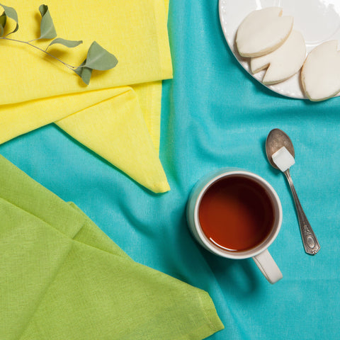 Now Designs flour sack towel chartreuse-turquoise-leaf pattern used to pat greens and fruit