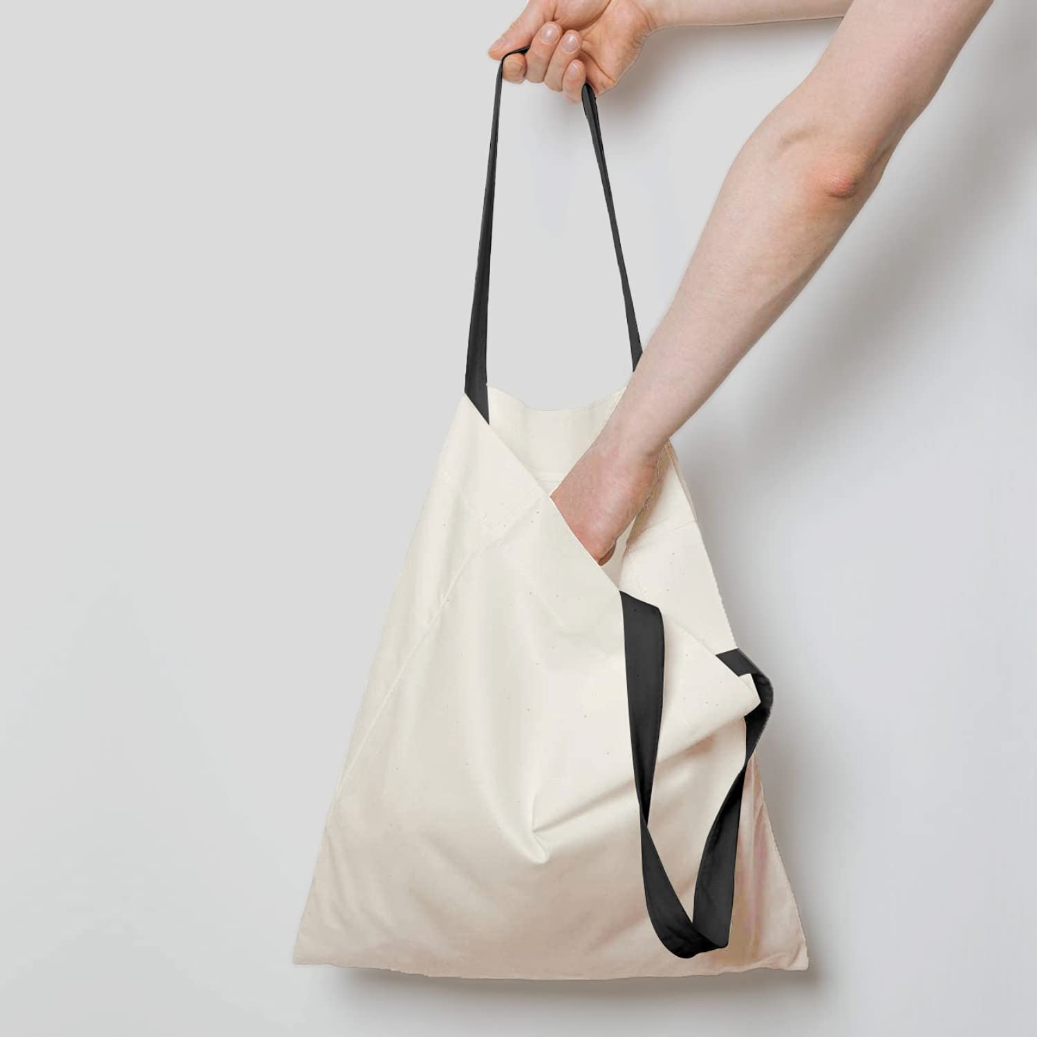 NPBAG tote on shoulder with reinforced seams for durable use.