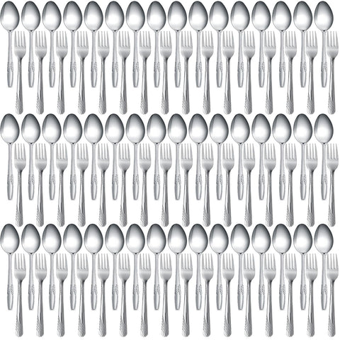 Nuogo 100-piece flatware set on a dining table with mirror finish for elegance.